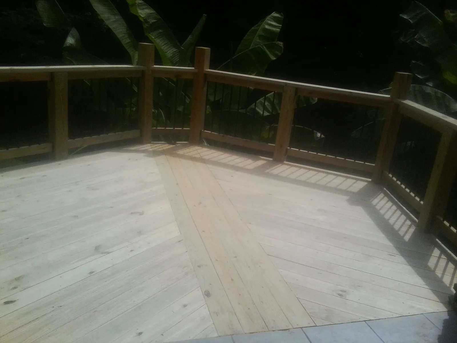 New wood deck and railing built off the back of a home in Bolingbrook